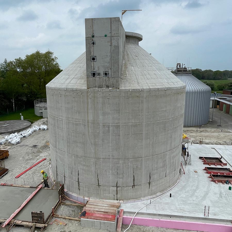 Digestion tower with hopper and cone roof and additionally an open sludge storage tank with hopper built by RSB Formwork Technology GmbH